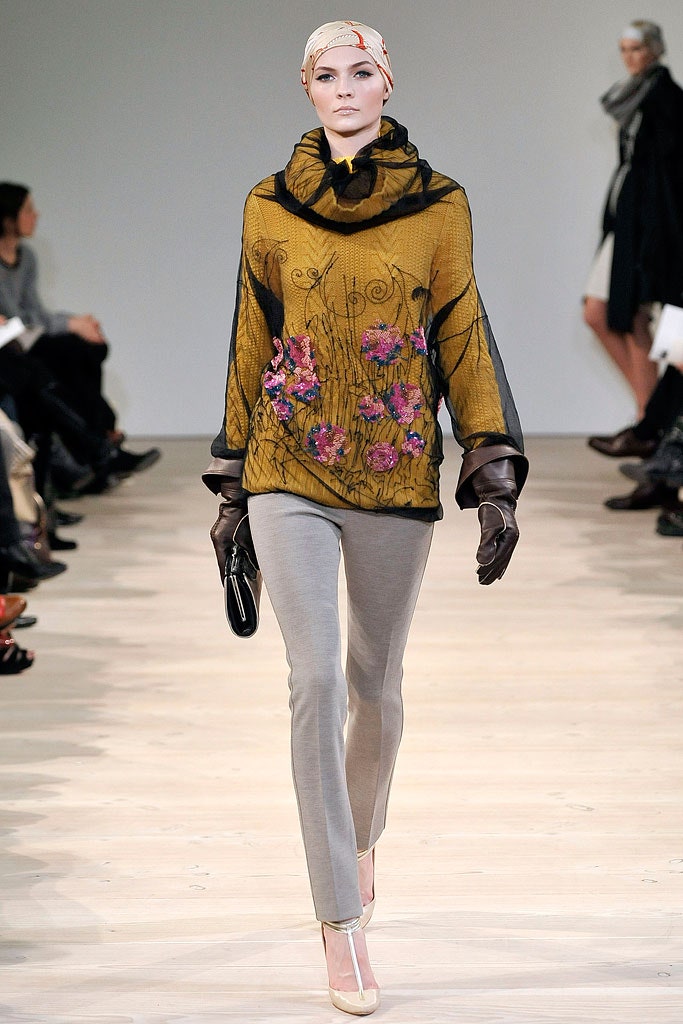 yellow embroidered top with gray pants