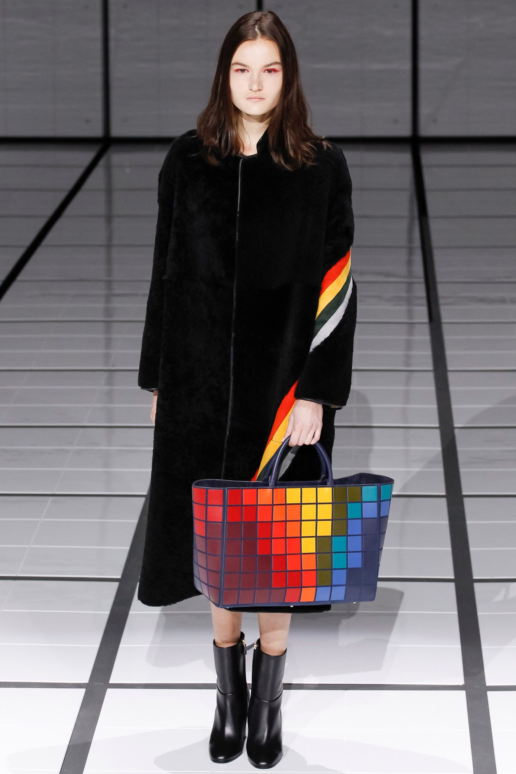 black faux-fur coat with colorful bag
