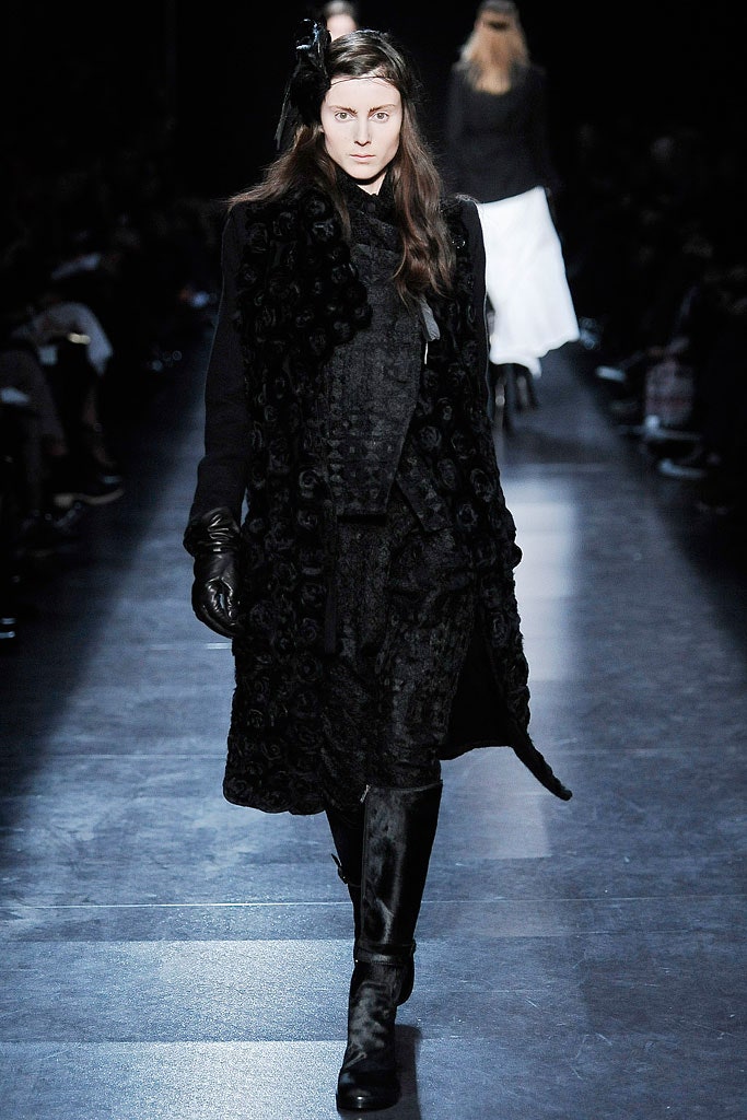 black wool coat with leather gloves