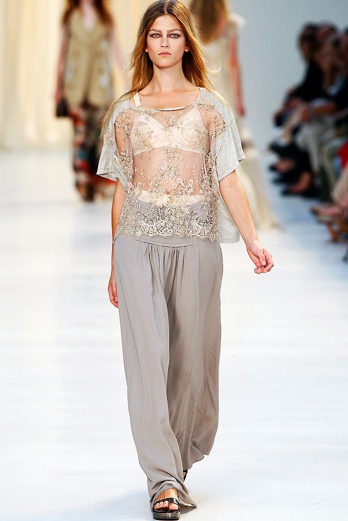 gray embroidered sheer top and beige wide-leg pants