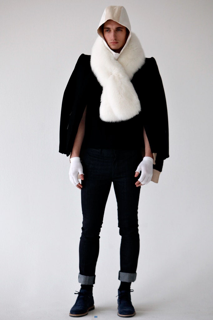 black structured jacket with white fur scarf