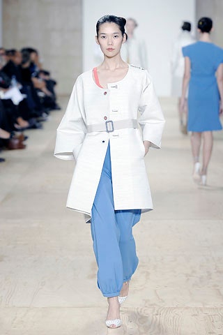 white relaxed coat with blue pants