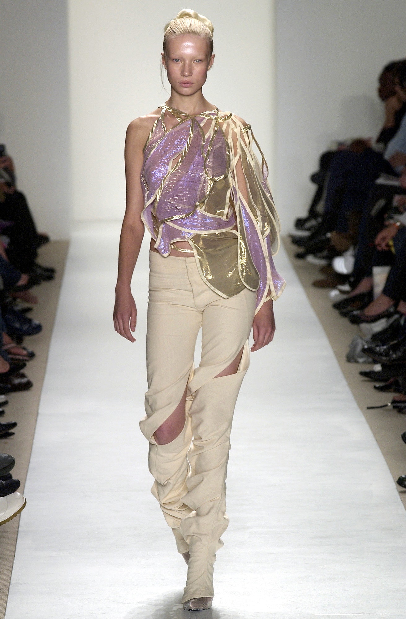 asymmetric purple silk top and beige pants