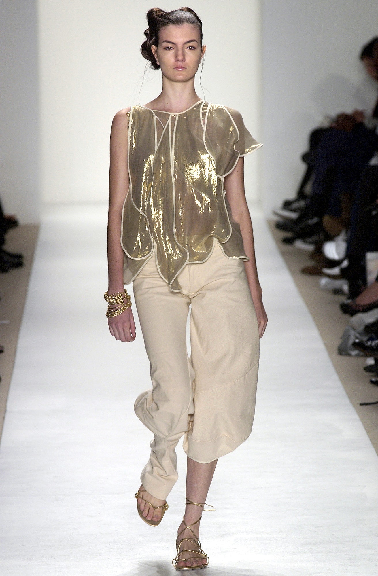 beige silk draped top with wide-leg pants