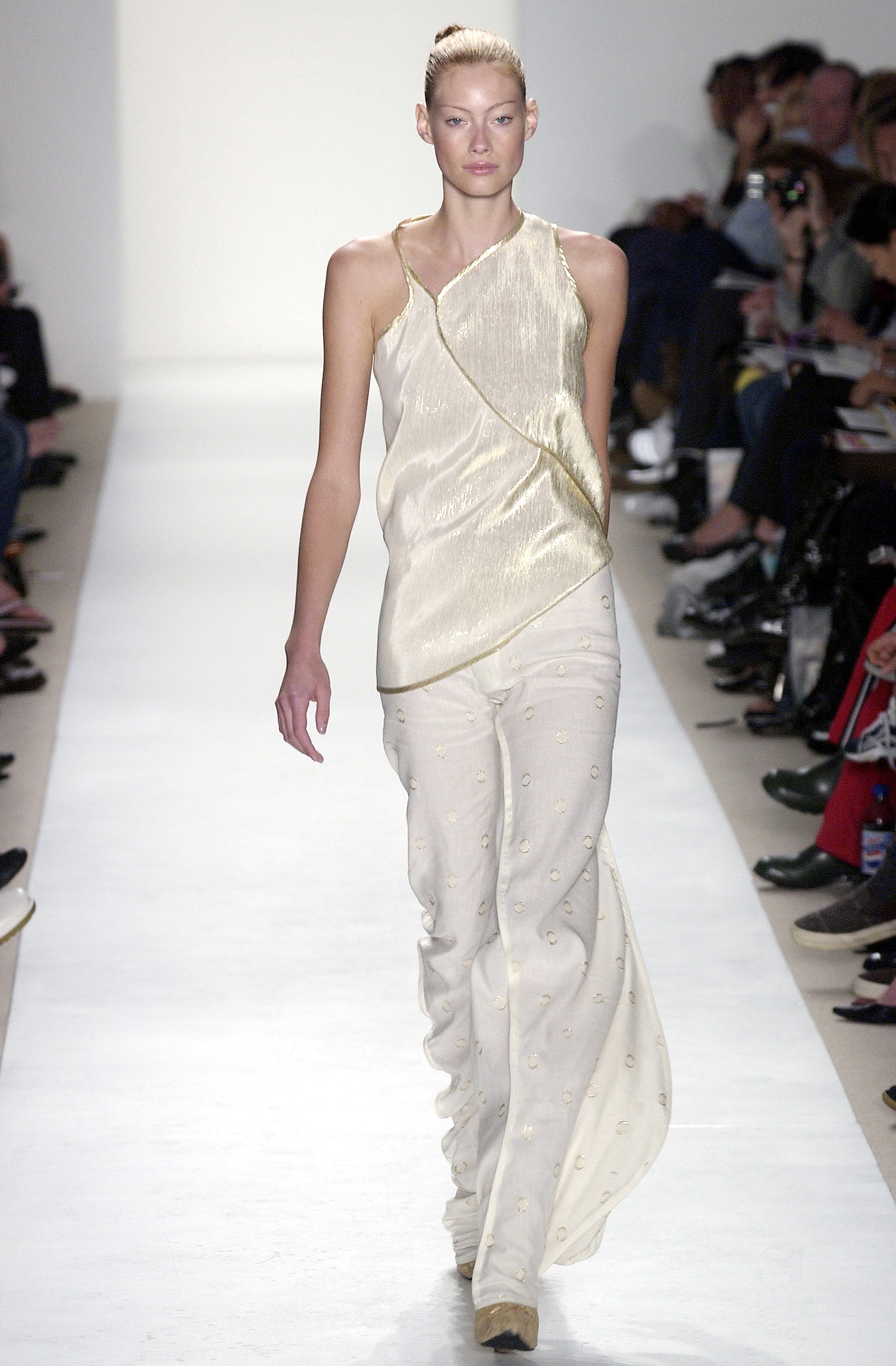 gold silk asymmetric top and beige pants