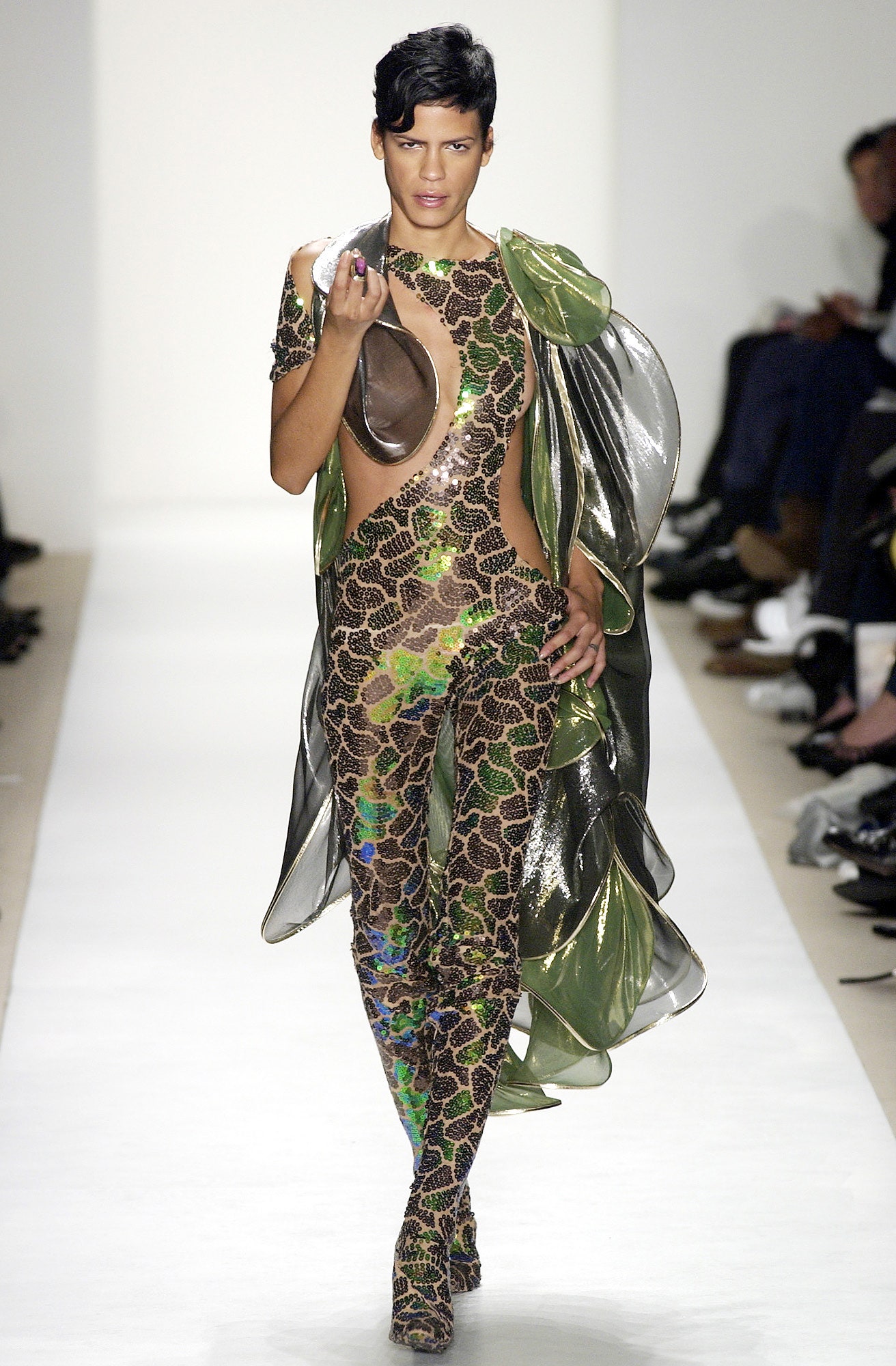 shiny green and brown catsuit with cape