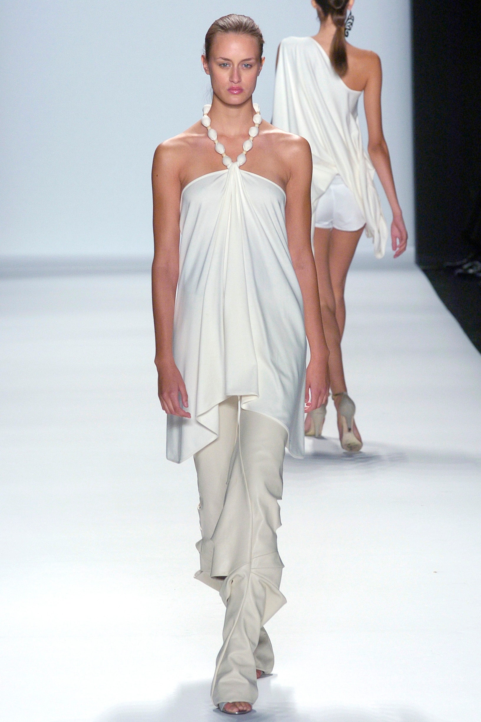 white silk relaxed top and fitted pants