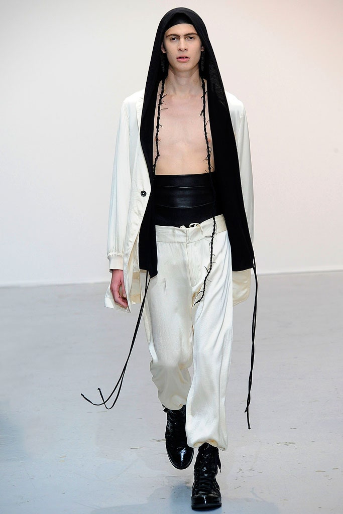 white silk hooded jacket and black fitted pants