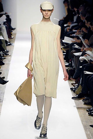 beige silk sleeveless high-neck relaxed pleated mini dress