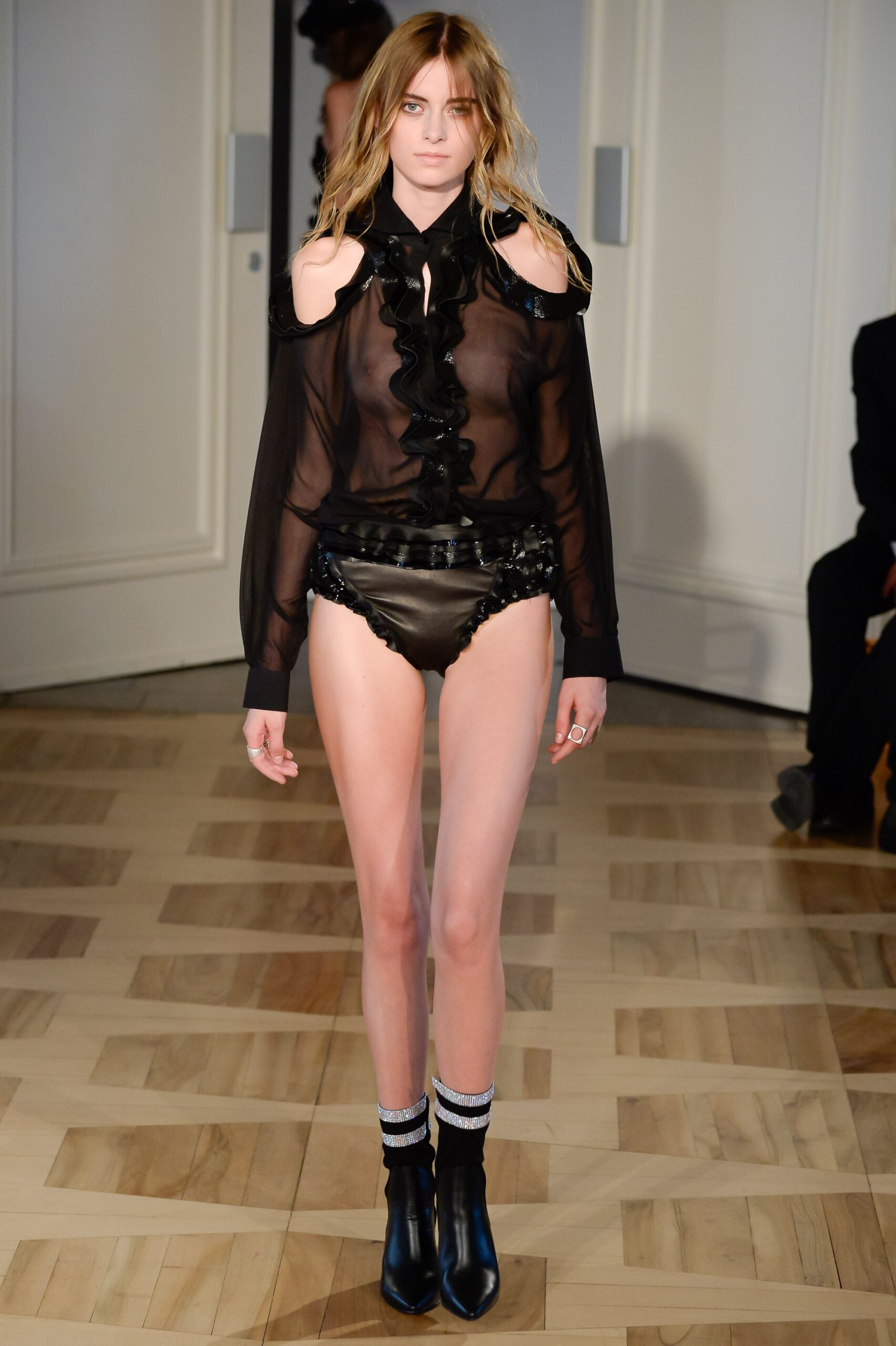 black silk blouse with leather shorts