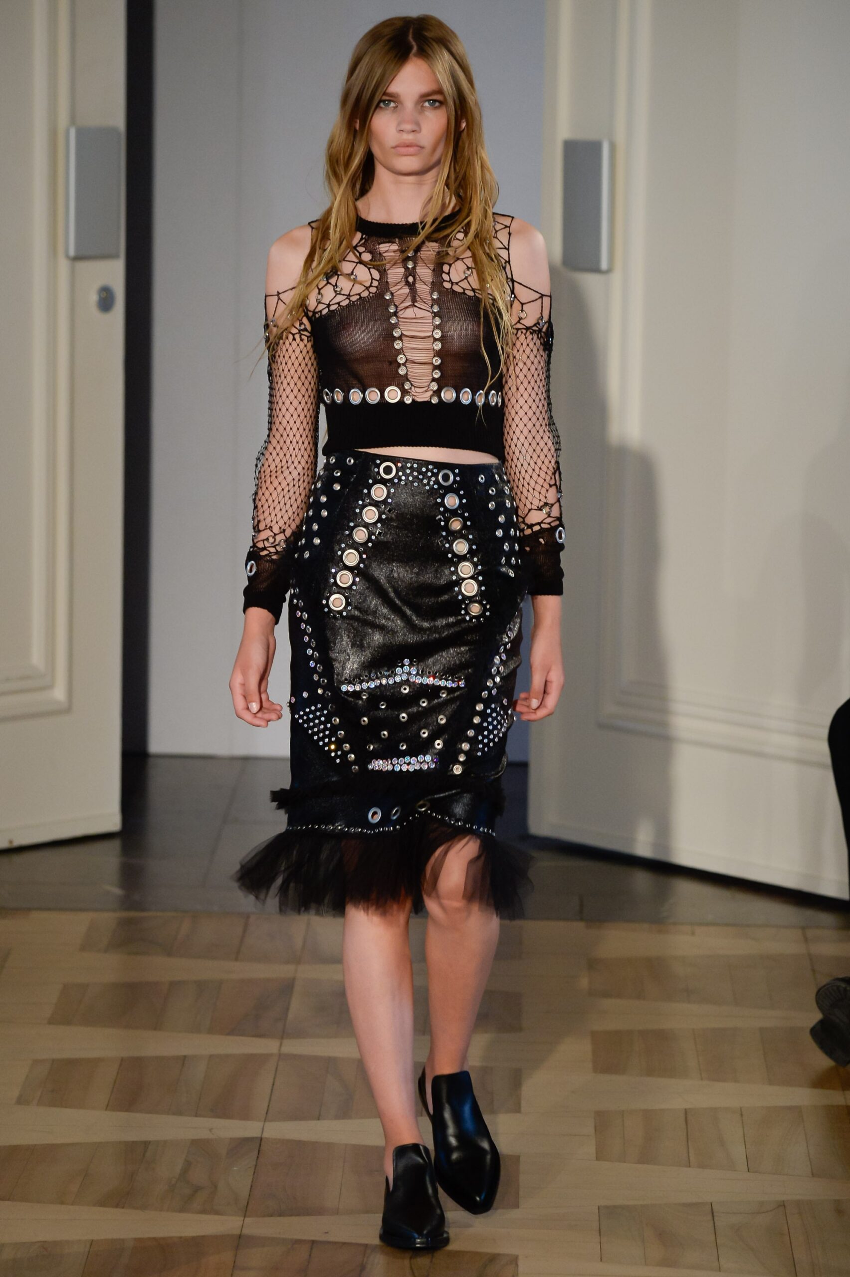 black mesh top and leather skirt