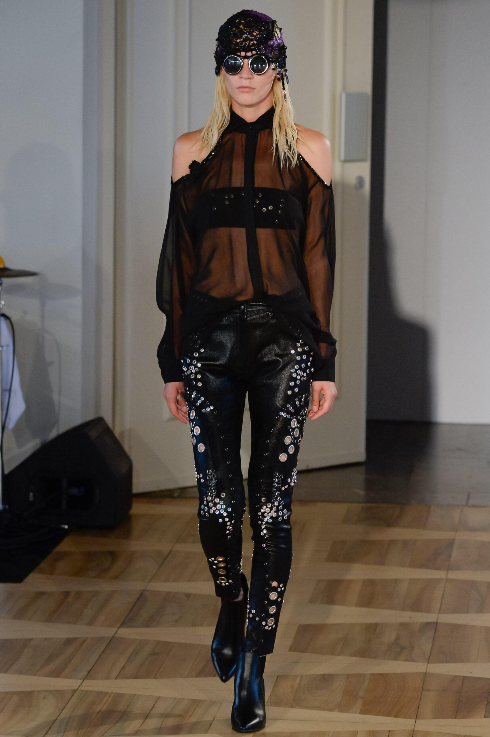 black silk off-shoulder blouse and leather pants
