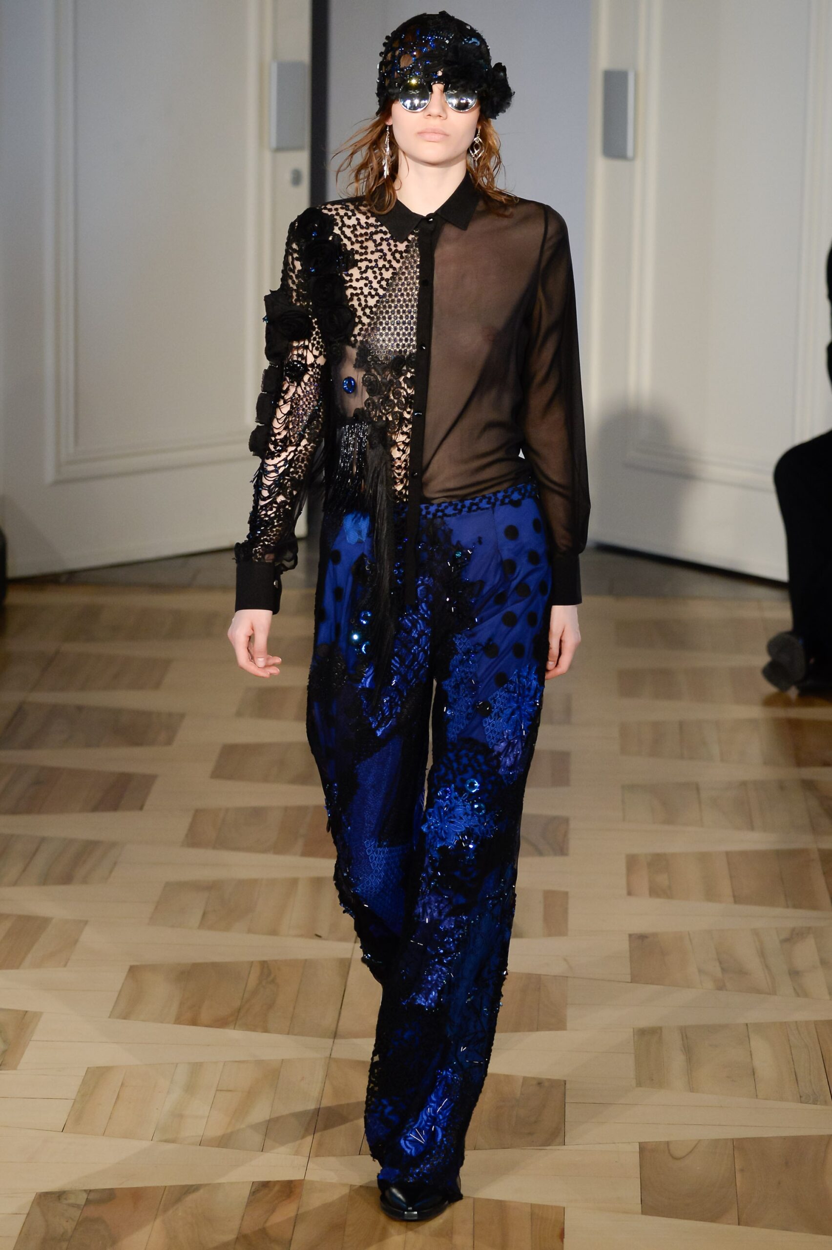 black sheer shirt with blue sequined pants