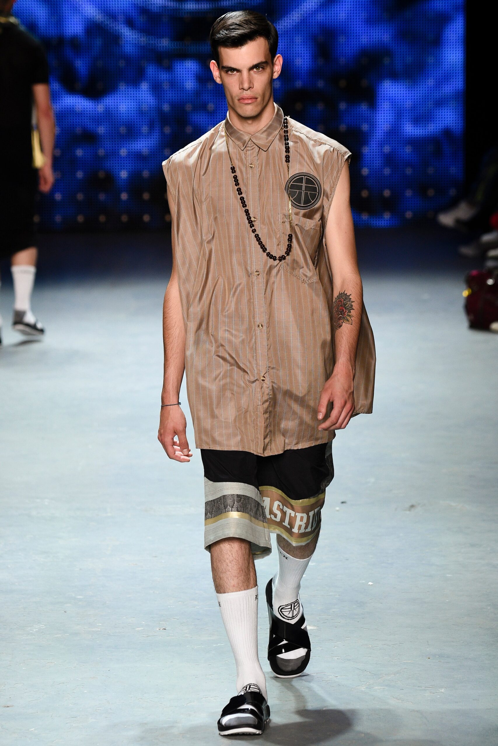 oversized beige shirt with relaxed shorts