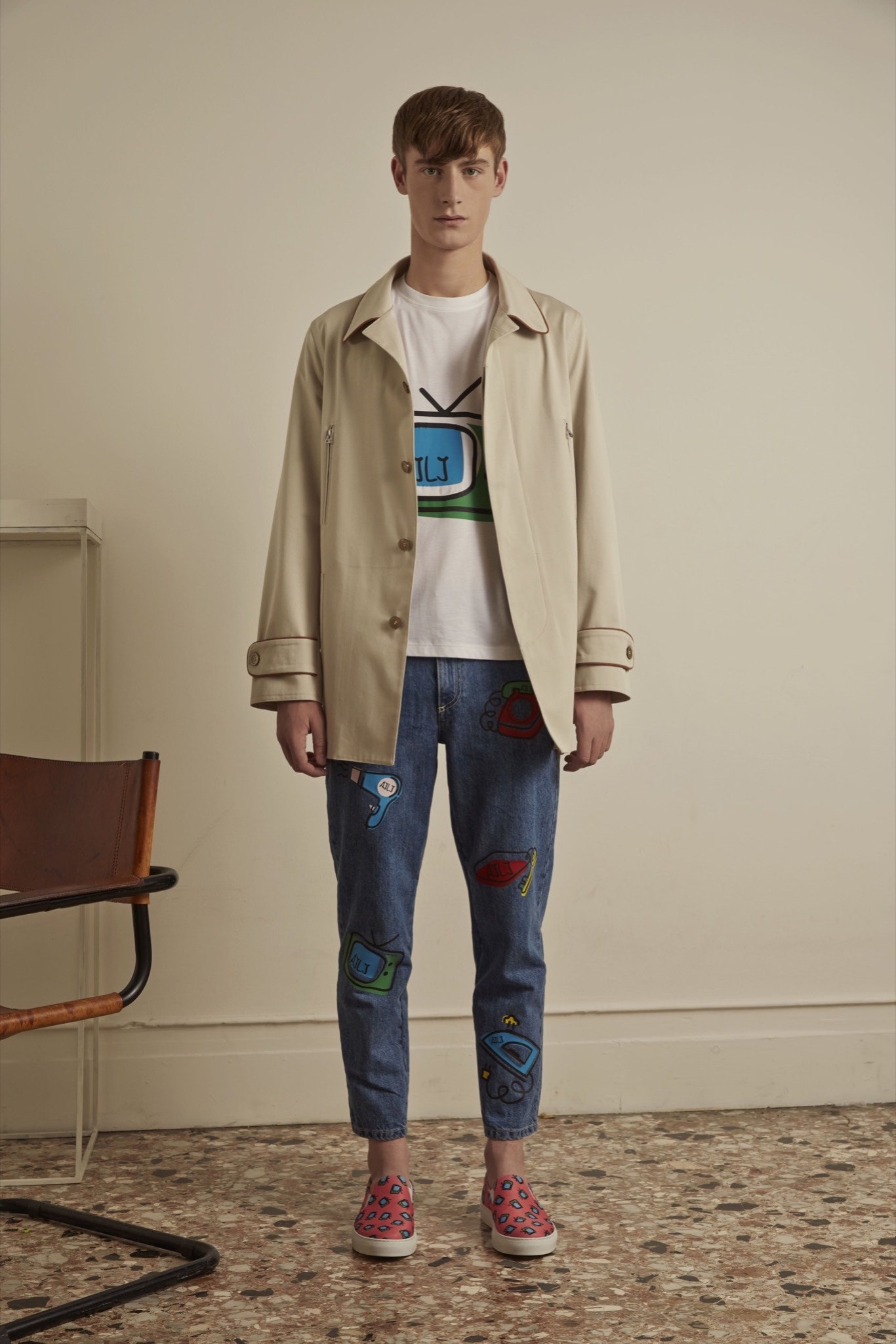 beige jacket white t-shirt blue pants