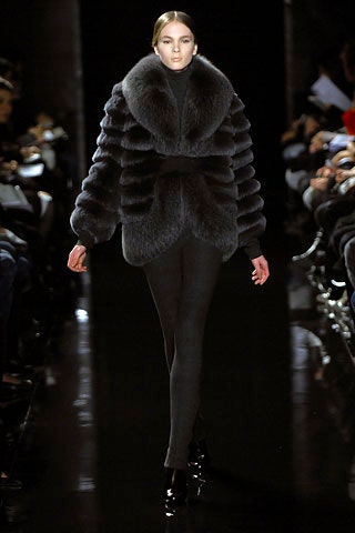 gray fur coat with fitted pants