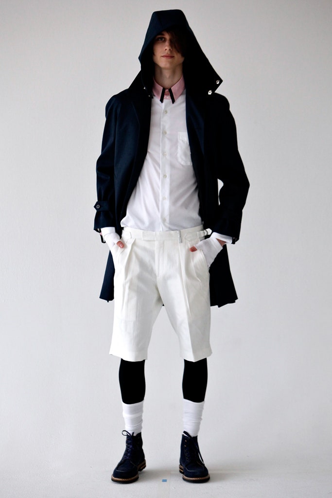black coat with white shirt and shorts