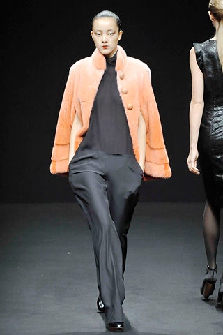 orange fur coat with black top