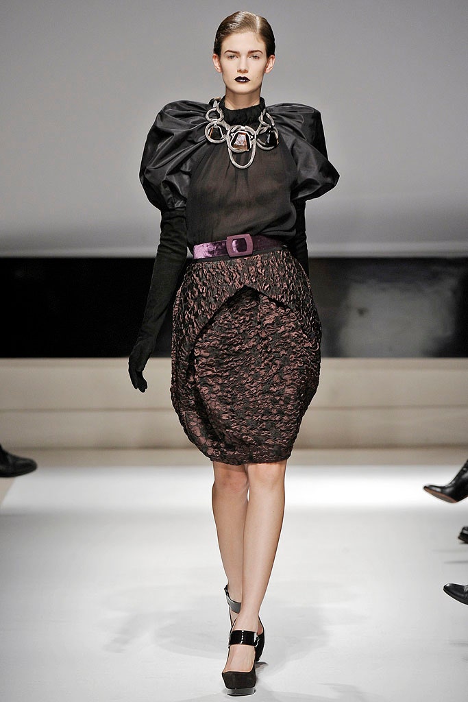 black silk blouse and purple skirt