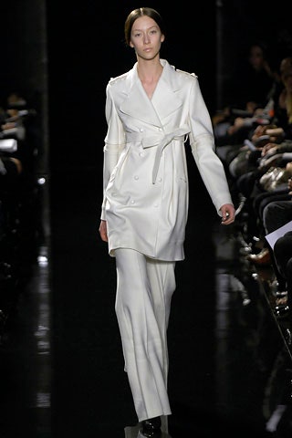 white silk fitted coat and tailored pants