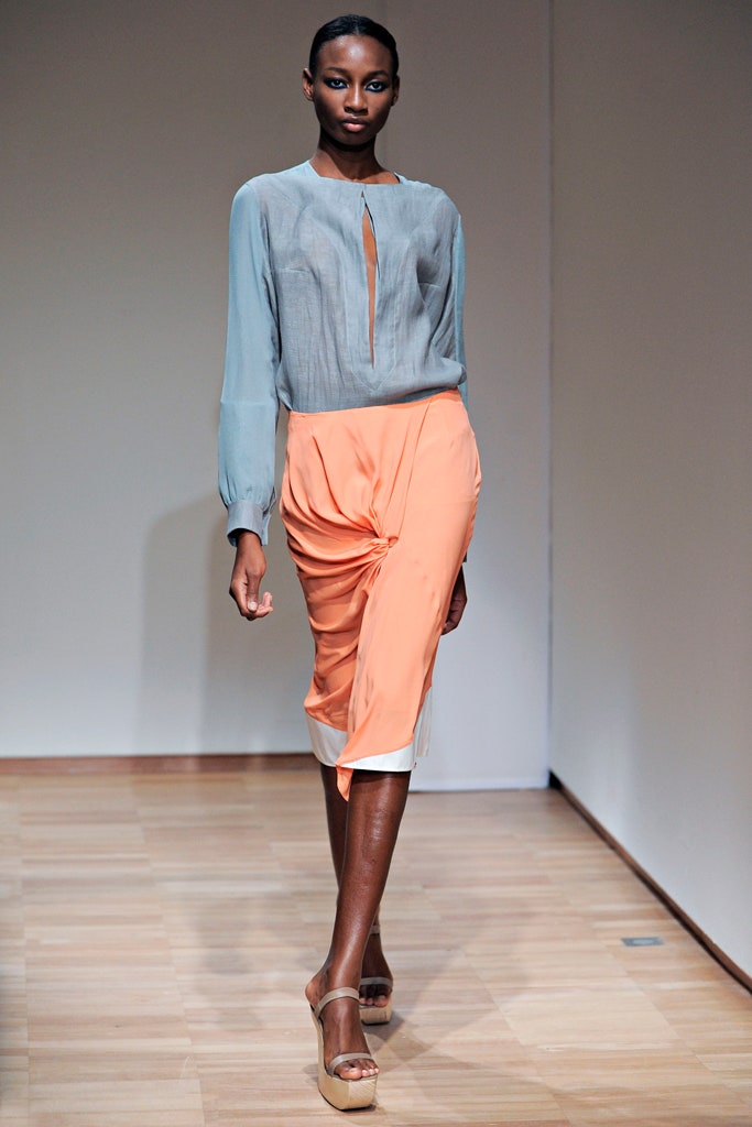 gray silk blouse with orange skirt