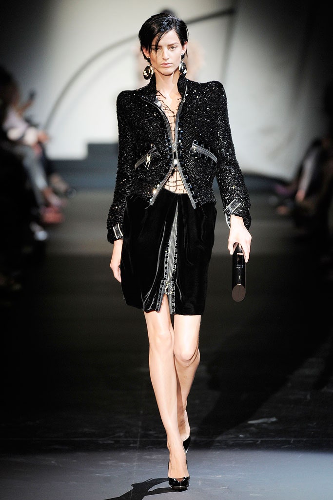 black fitted jacket and mini skirt