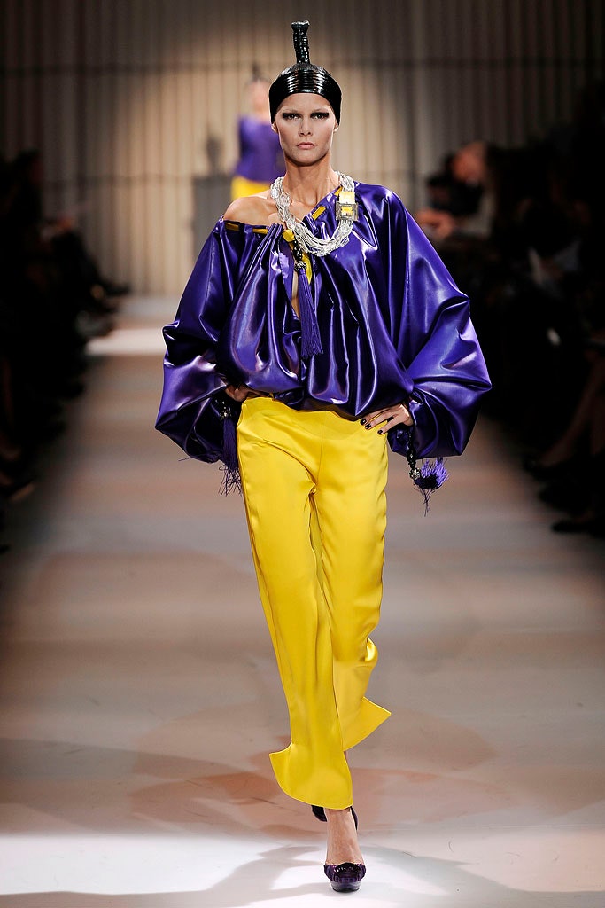 purple silk top and yellow pants