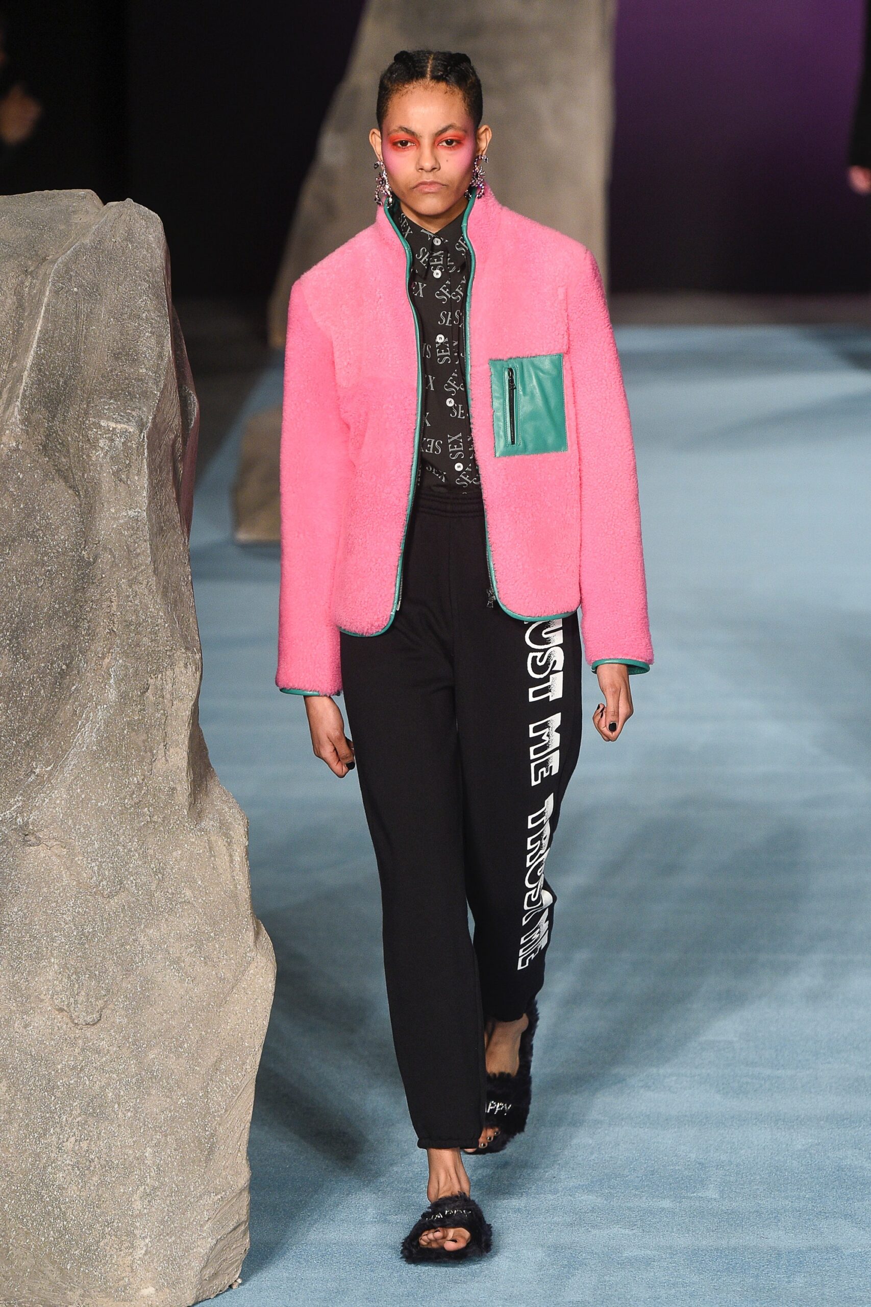 pink faux-fur jacket and black pants