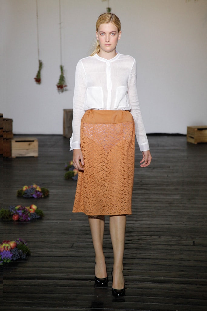white fitted blouse and orange lace skirt