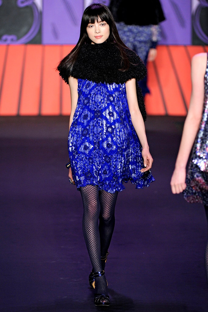 blue sequined mini dress with black cape