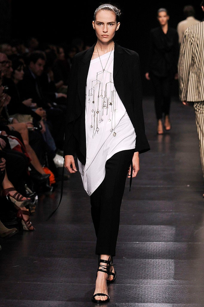 asymmetric black and white top with fitted pants