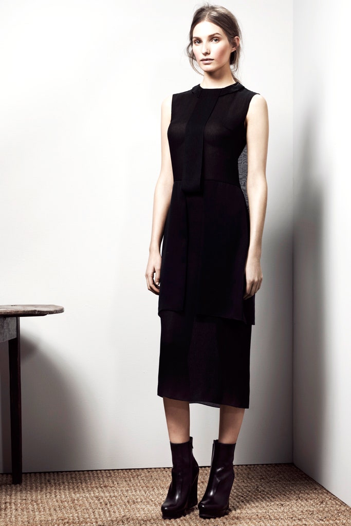 black fitted midi dress and boots