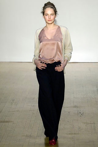 pink silk top with black pants