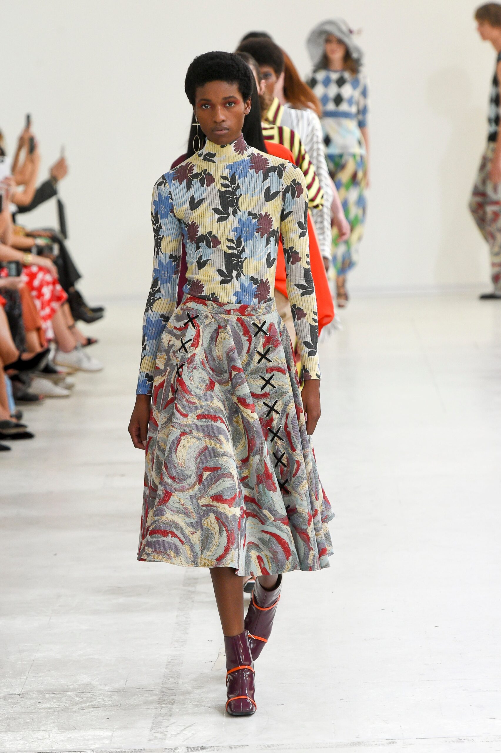multi-colored top and flared skirt