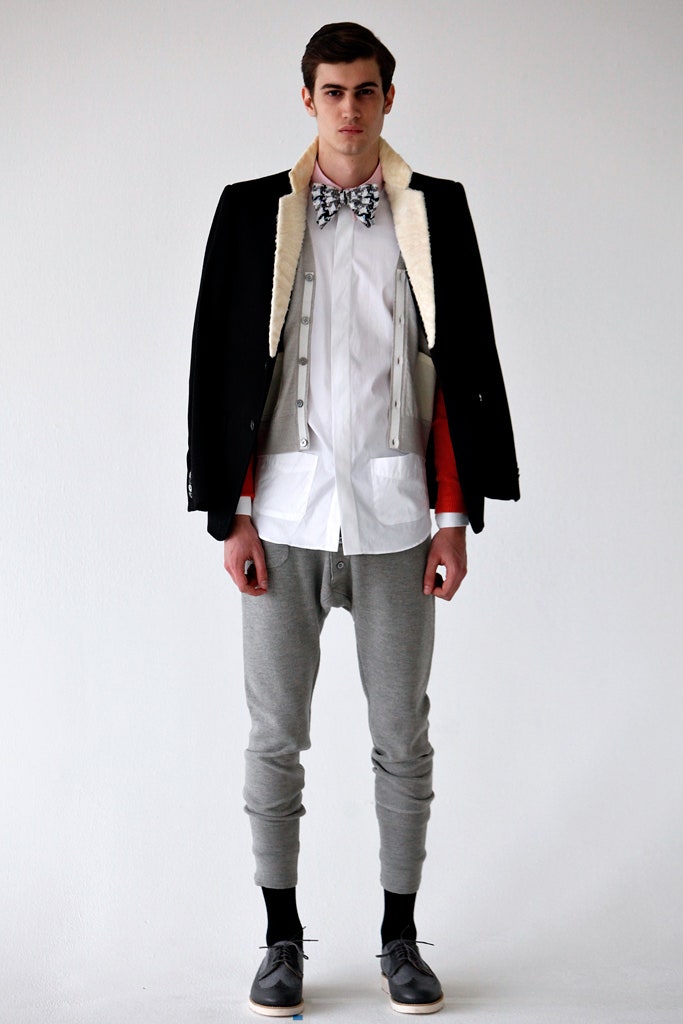 black tailored jacket with gray pants