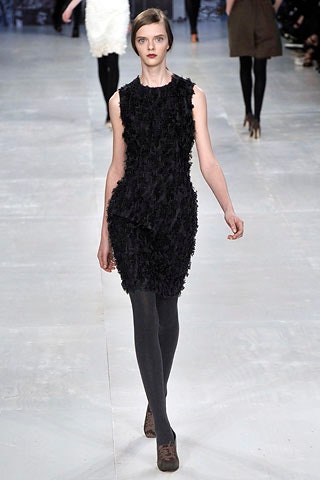 black ruffled sleeveless mini dress