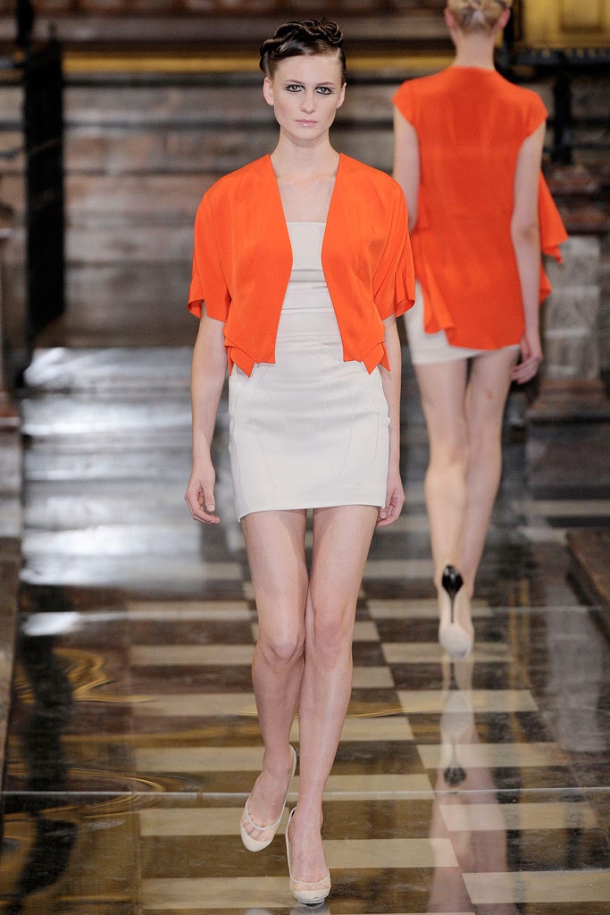 orange top and white mini-dress