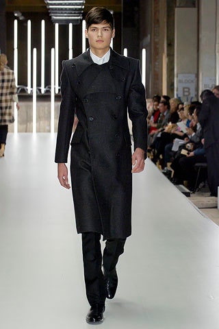 black wool fitted coat and tailored pants