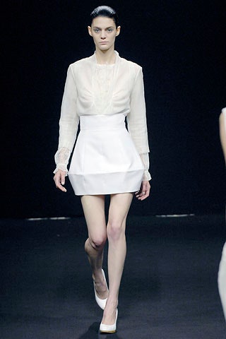 white silk blouse and mini skirt