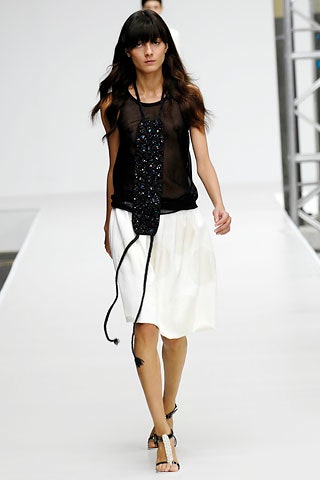 black sheer top white pleated skirt