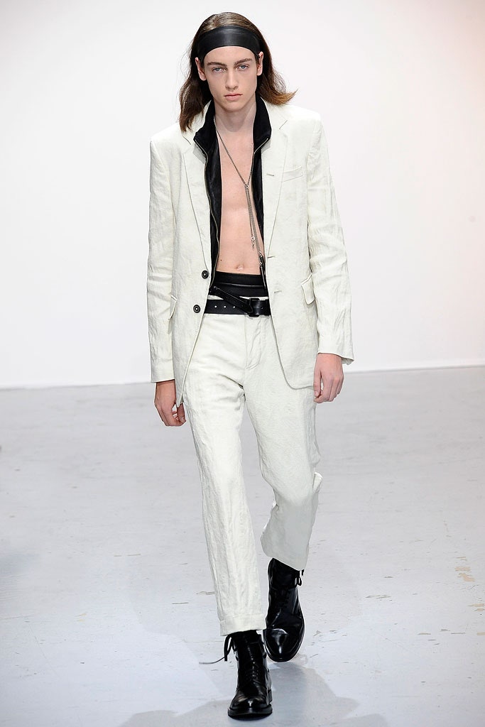 white tailored suit with black shoes