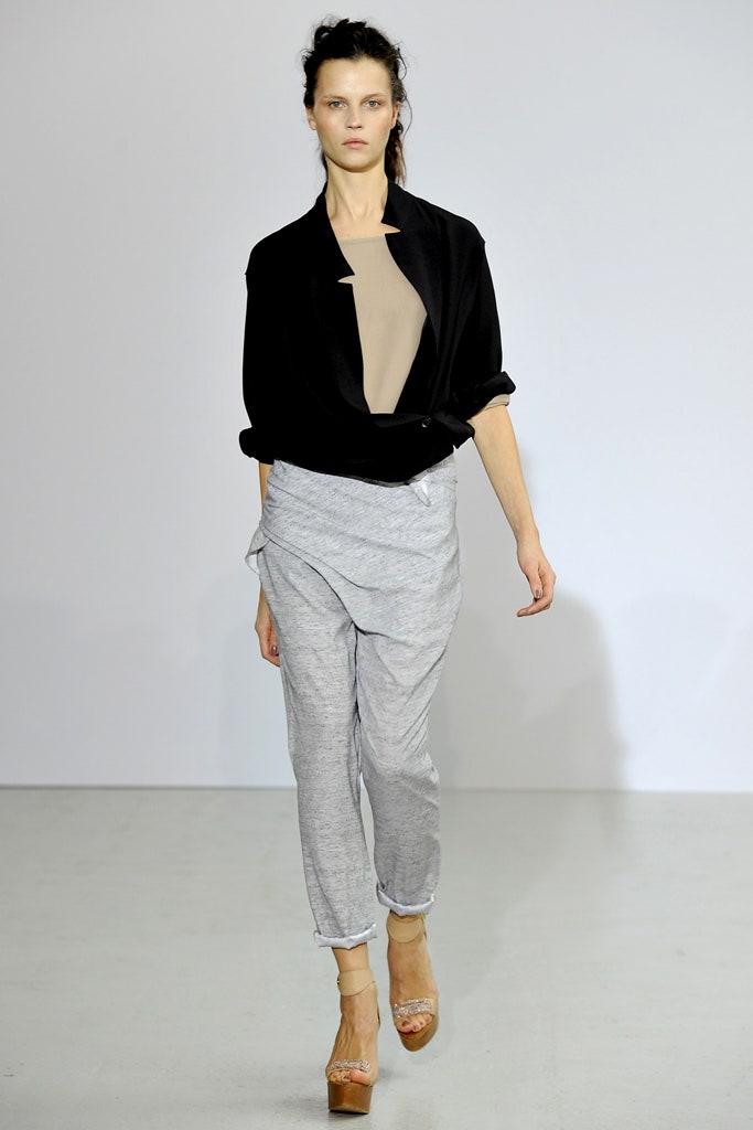 black relaxed jacket beige fitted top gray draped pants