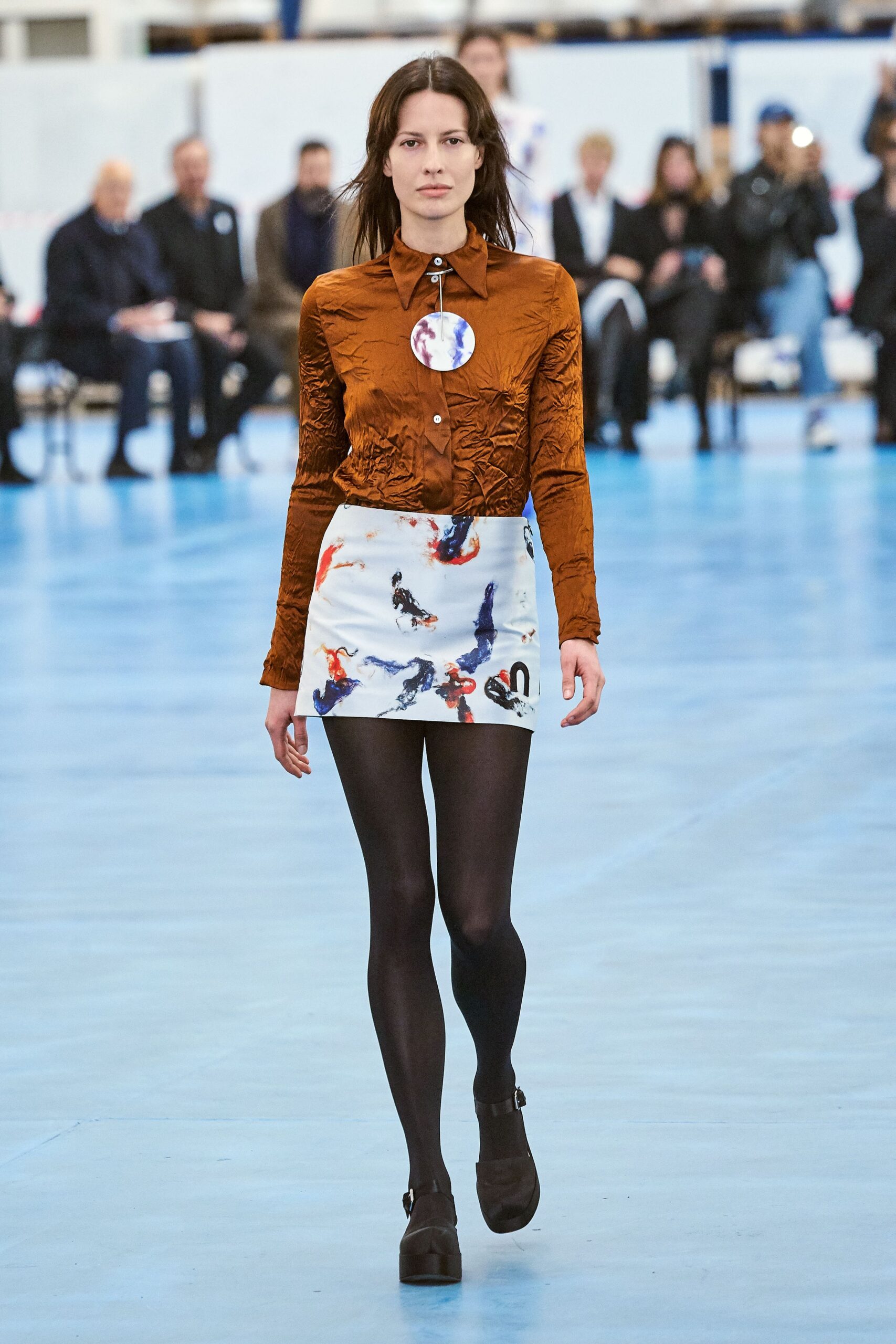 brown fitted shirt and white printed skirt