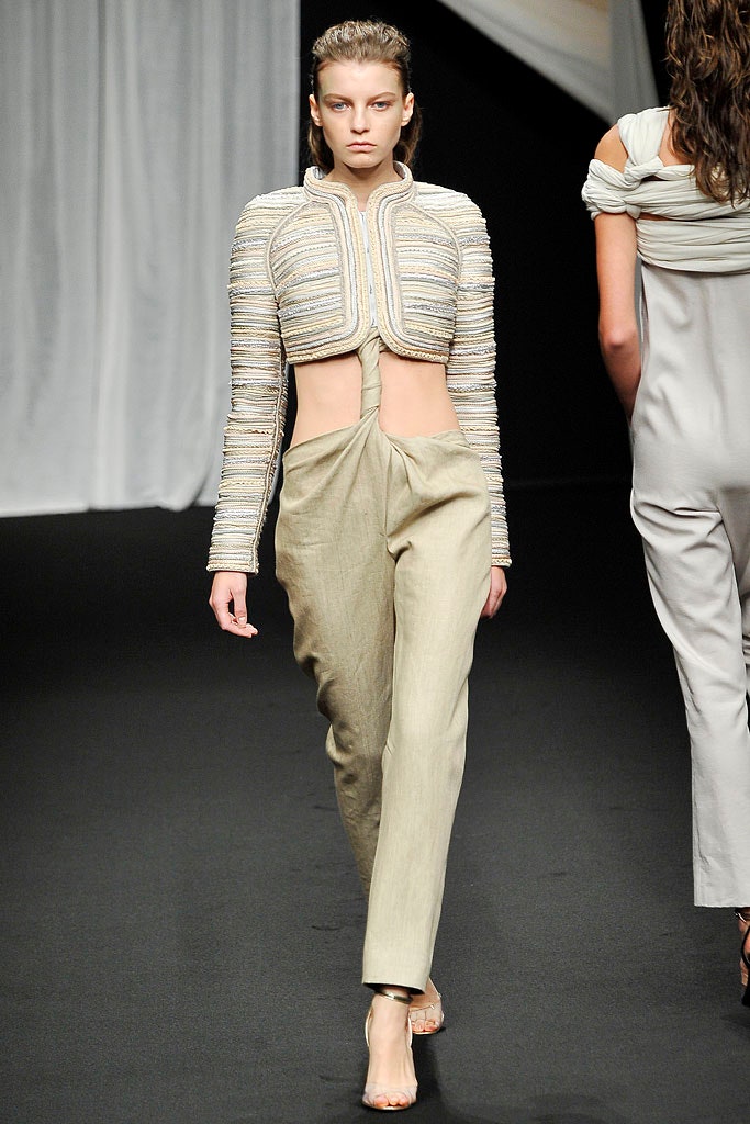 beige embroidered sleeveless top with relaxed pants