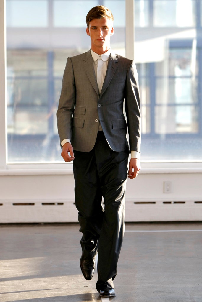 gray tailored suit with black pants