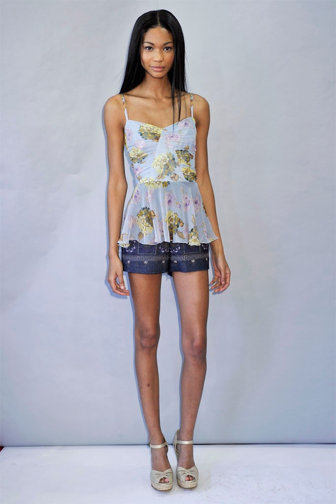 blue silk ruffled top with denim shorts