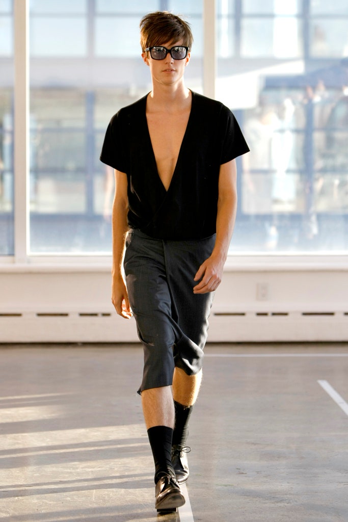 black fitted v-neck top with gray tailored pants