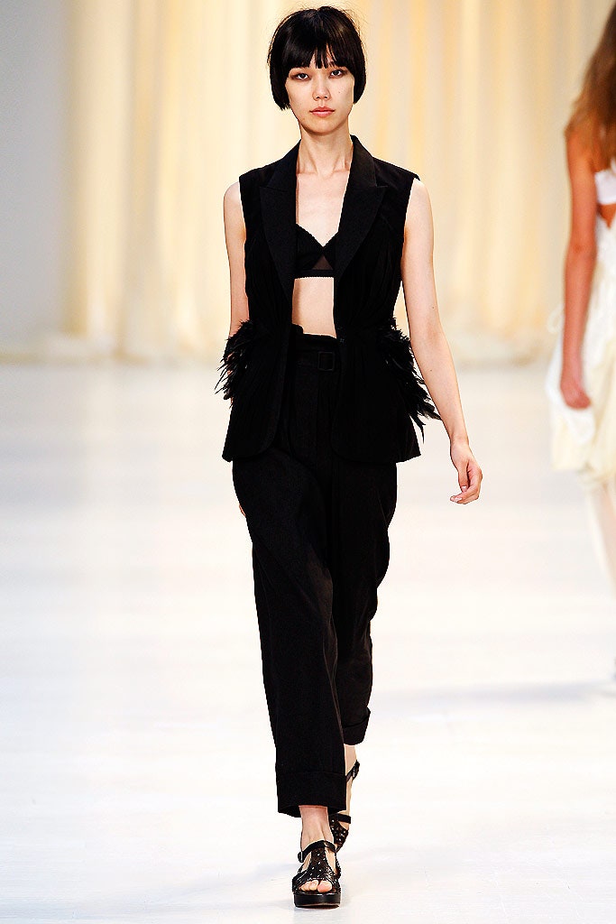 black fitted vest with tailored pants