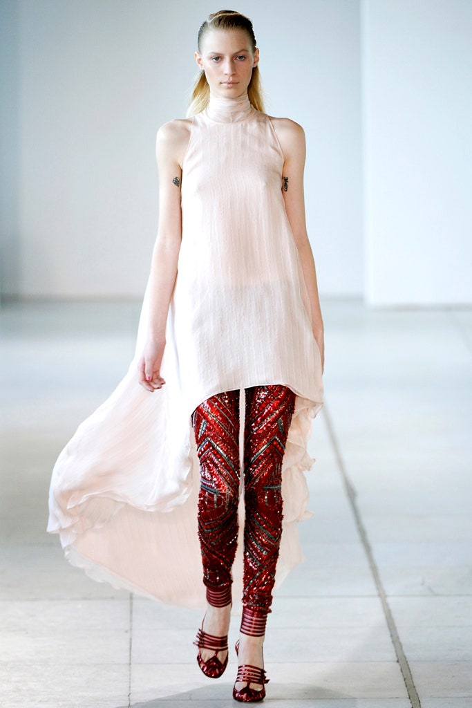 white silk relaxed top with embellished red pants