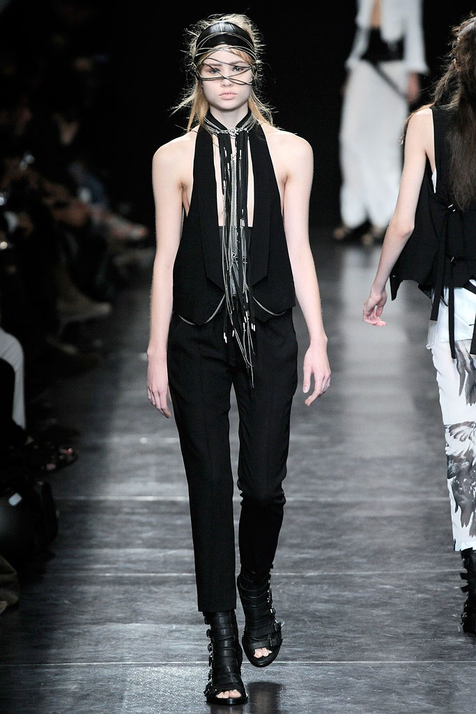 black fitted top and slim pants